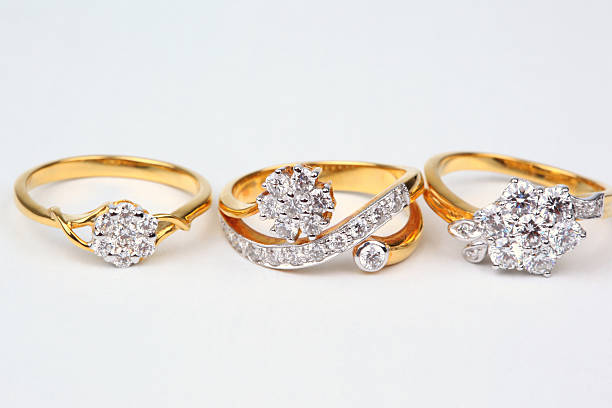 istock Three style of golden rings with diamond. 153197091