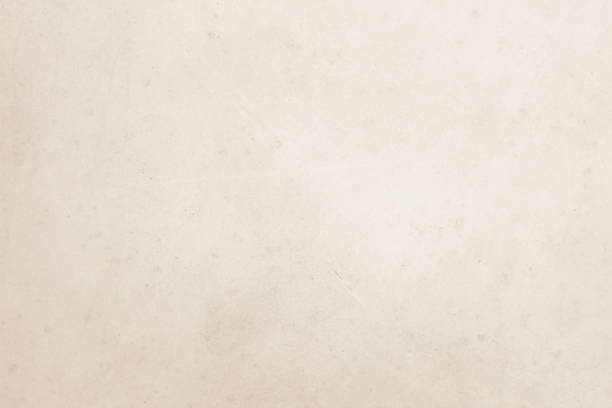 istock Colour old concrete wall texture background. Close Up retro plain cream color cement wall background texture. Design paper vintage parchment element show or advertise or promote product on display. 1531974095