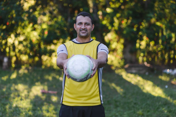 istock Amateur soccer player holding a ball invitingly 1531976268