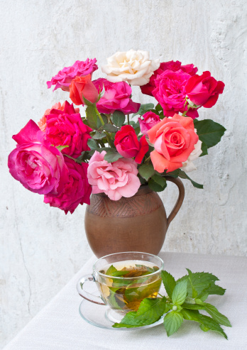 red roses and mint tea still life