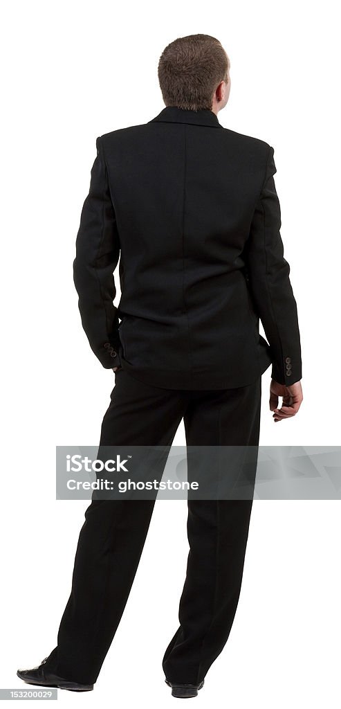 Vista posterior de un hombre de negocios en traje negro frente. - Foto de stock de De atrás hacia adelante libre de derechos