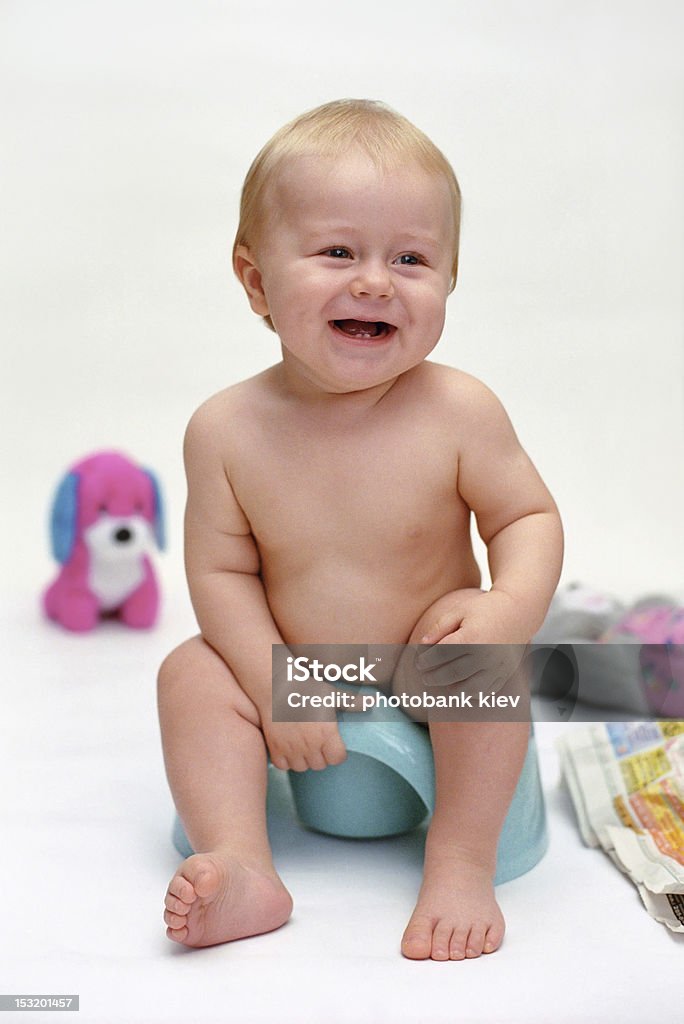 smiling baby on potty smiling baby on potty (from archive) 0-11 Months Stock Photo