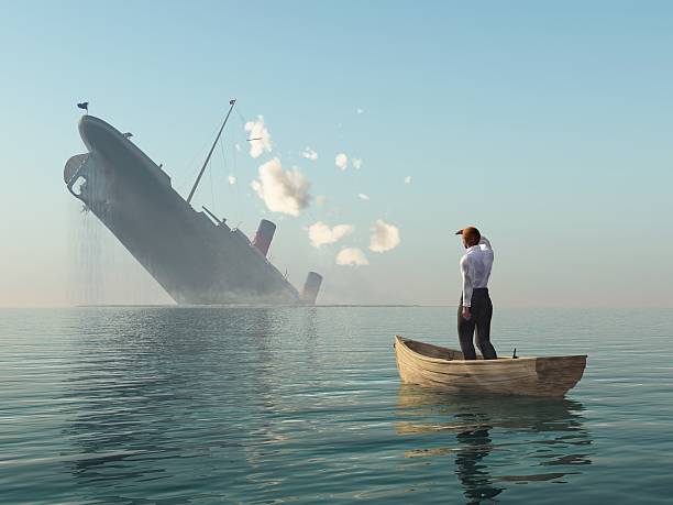 istock rescued man in boat looking on shipwreck 153201493
