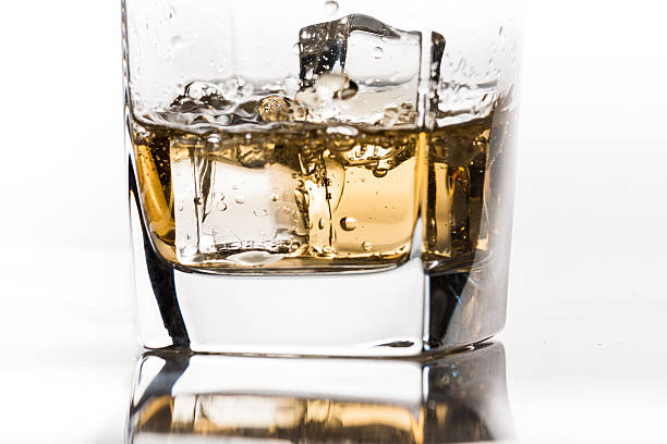 istock Pouring whiskey on the rocks close-up 153201574