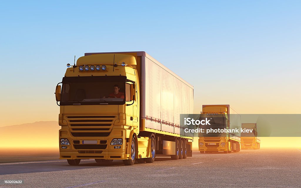 Convoy of yellow trucks on the road convoy of trucks Truck Stock Photo