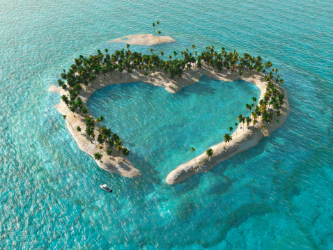 aerial view of heart-shaped tropical island