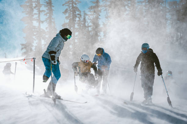 Friends getting ready to go skiing on a sunny winter day stock photo