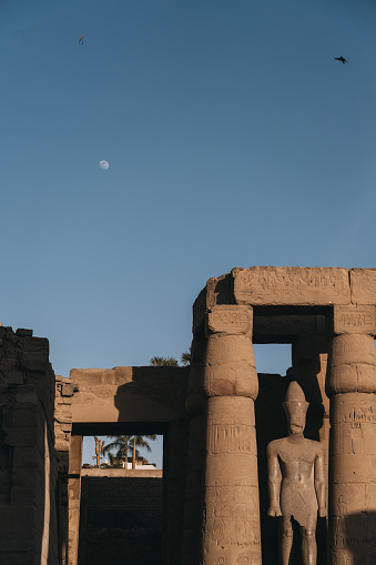 Hieroglyphic carvings and paintings on ceiling of ancient egyptian temple