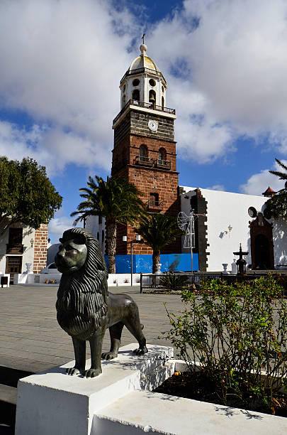 Teguise, Lanzarote, Canary Island, Church Church of Our Lady of Guadalupe on Plaza de la Constitucion with bronze lion