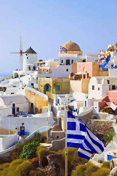 istock Santorini view (Oia) and greek flag 153205160