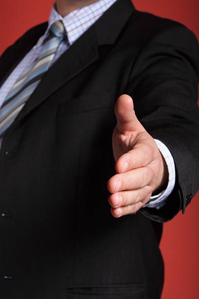 istock business man open hand ready to seal a deal 153208677