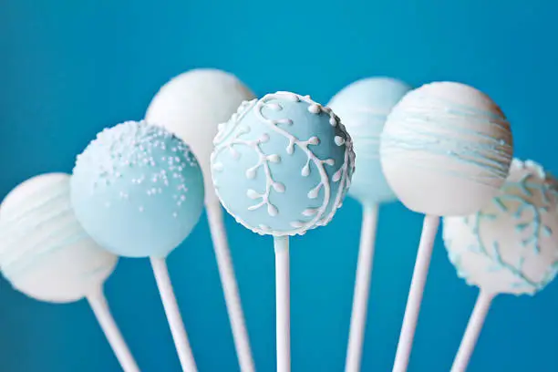 Cake pops decorated in blue and white