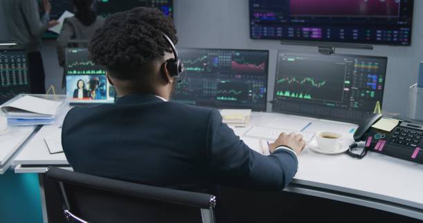 istock African American trader analyzes market charts 1532094354