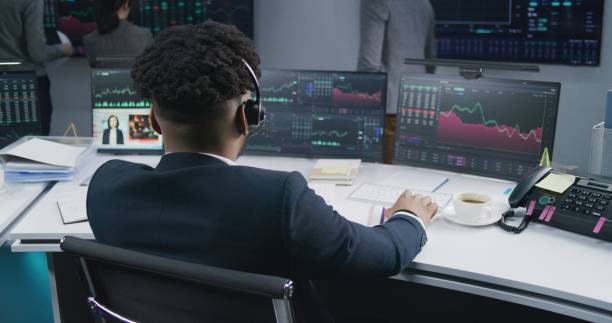 istock African American trader analyzes market charts 1532095496