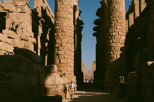 The great stone columns and statues in Luxor temple in the East bank in  Egypt