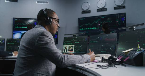 istock African American trader with pen in hand works 1532108210