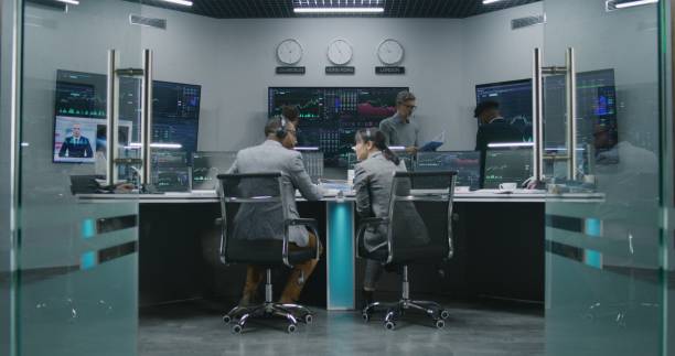 istock Team of traders work on multi-monitor computers 1532152297