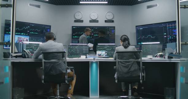 istock Team of traders work on multi-monitor computers 1532153326