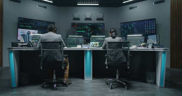 istock Team of traders work on multi-monitor computers 1532155689