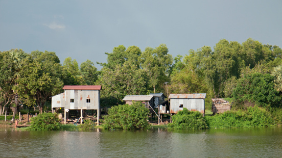 Farmhouses on stilts on the banks of Serei Sophorn River in Sisophon, Banteay Meanchey province in Northwestern Cambodia.