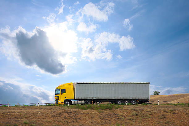 istock auto truck goes on the way 153216654