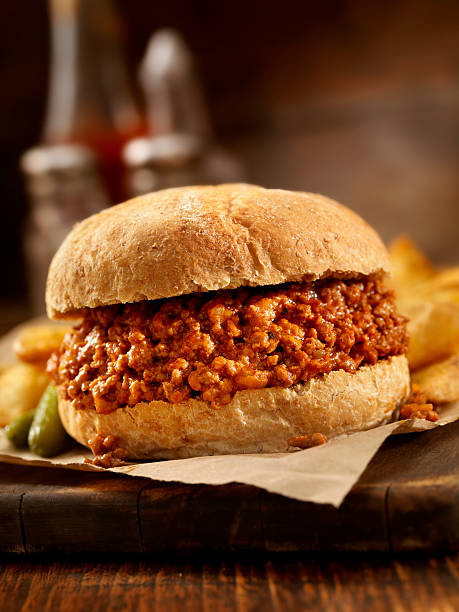 Sloppy Joe Sloppy Joe with Wedge Cut Fries -Photographed on Hasselblad H3D2-39mb Camera sloppy joes stock pictures, royalty-free photos & images