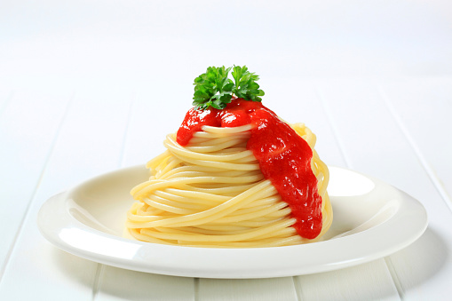 Spaghetti with sauce and herbs