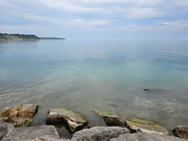 istock Huron Lake Sunset Goderich beach stones rocks cliffs clear water evening Ontario Canada landscape 1532206651
