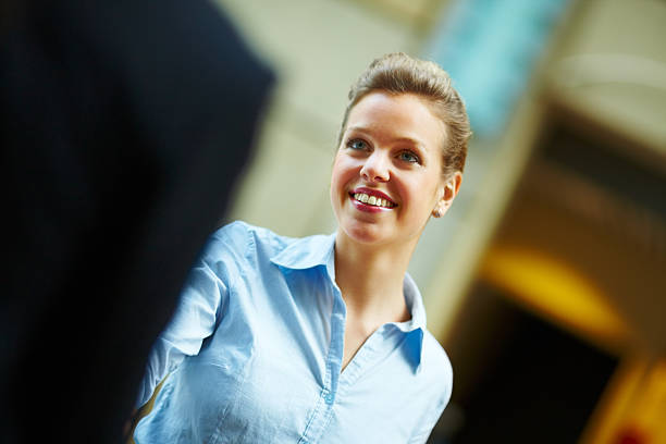 istock Businesswoman shaking hands and smiling 153220785