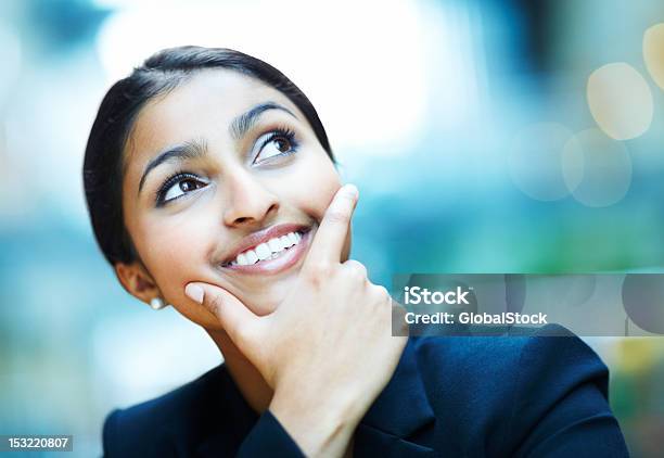 Businesswoman Looking Up And Smiling Stock Photo - Download Image Now - 20-24 Years, 20-29 Years, Adult