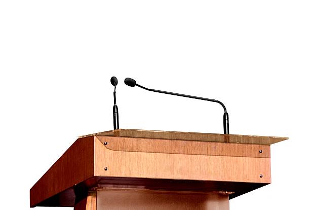 istock Seminar podium and microphones over white 153220835
