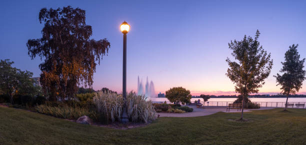 Bordeaux, France, Public park with still waters on a lake and the branches of nearby trees overhanging the water. There is a mock Grecian 18th century statue beside the lake.It is between Cours de Verdun and Rue de la Course.