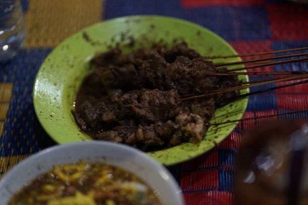 istock Lontong dekem, meat satay & topping srundeng satay 1532224166