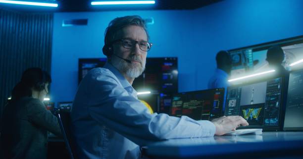 istock Flight control employee in headset looks at camera 1532279514