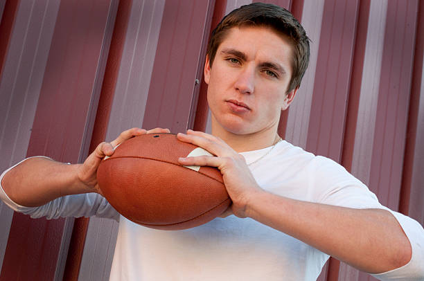 istock Handsome Young Man Holding Football 153228175