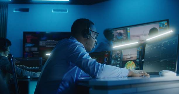 istock African American flight control employee monitors space mission 1532285052