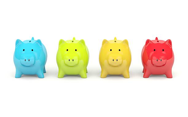 istock Colored piggy banks front-facing in a line 153228620