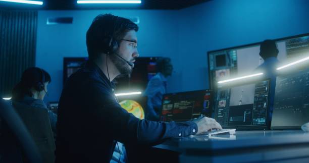 istock Flight control operator claps hands with group of workers after spacecraft lift off 1532290715