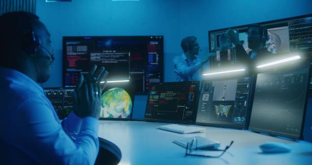 istock African American flight control employee monitors space mission 1532292195