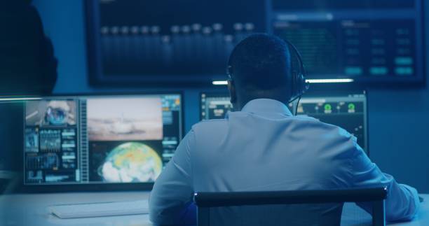 istock Employee monitors space mission, claps hands after space rocket launch 1532303758