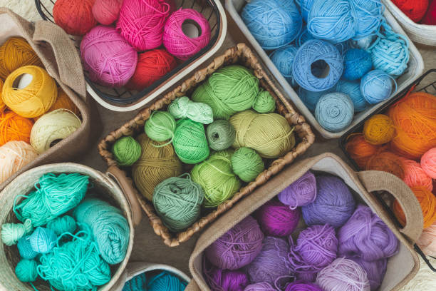 istock Many baskets made of natural eco-friendly materials. Multicolor yarn for knitting, knitting needles 1532309018
