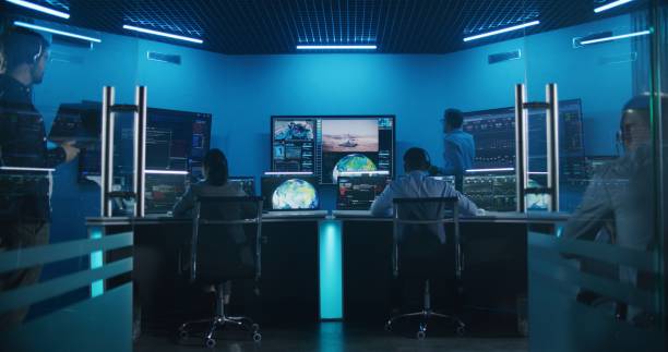 istock Team watch space rocket launch on big digital screens in mission control center 1532326015