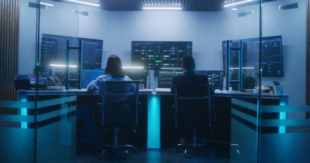 istock Diverse IT technical specialists work on computers in monitoring office 1532328068