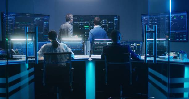 istock Team of IT technical specialists and software programmers work in monitoring office 1532332127