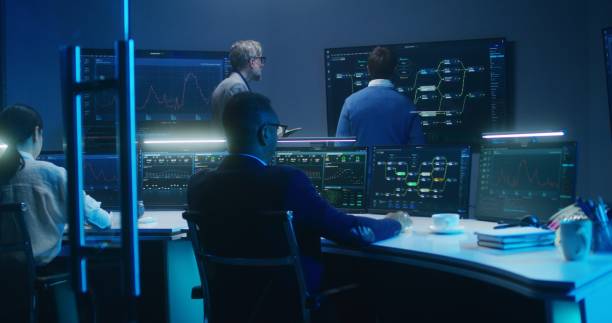 istock Team of IT technical specialists and software programmers work in monitoring office 1532333688