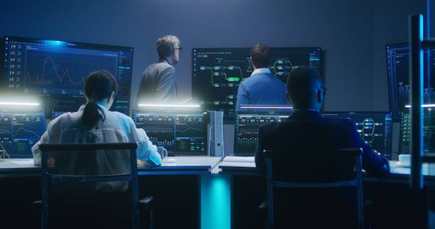 istock Team of IT technical specialists and software programmers work in monitoring office 1532334756
