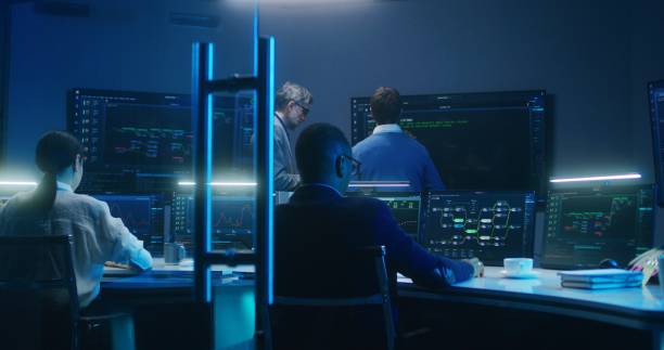 istock Team of IT technical specialists and software programmers work in monitoring office 1532335804