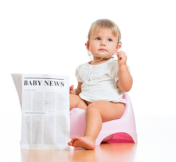funny child girl sitting on chamberpot with eyeglasses and newsp funny child girl sitting on chamberpot with eyeglasses and newspaper accustom stock pictures, royalty-free photos & images