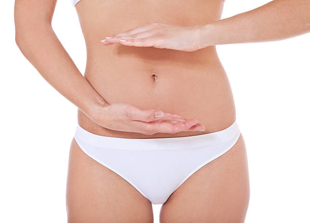 istock Woman protecting her belly with hands 153236127