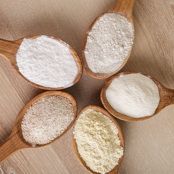 Different types of flour in wooden spoons Various types of flour in five wooden spoons finely stock pictures, royalty-free photos & images
